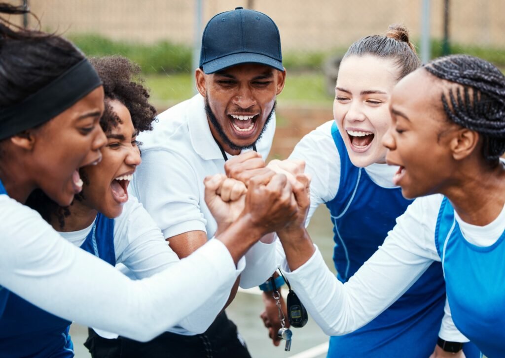 athletes joining in a circle