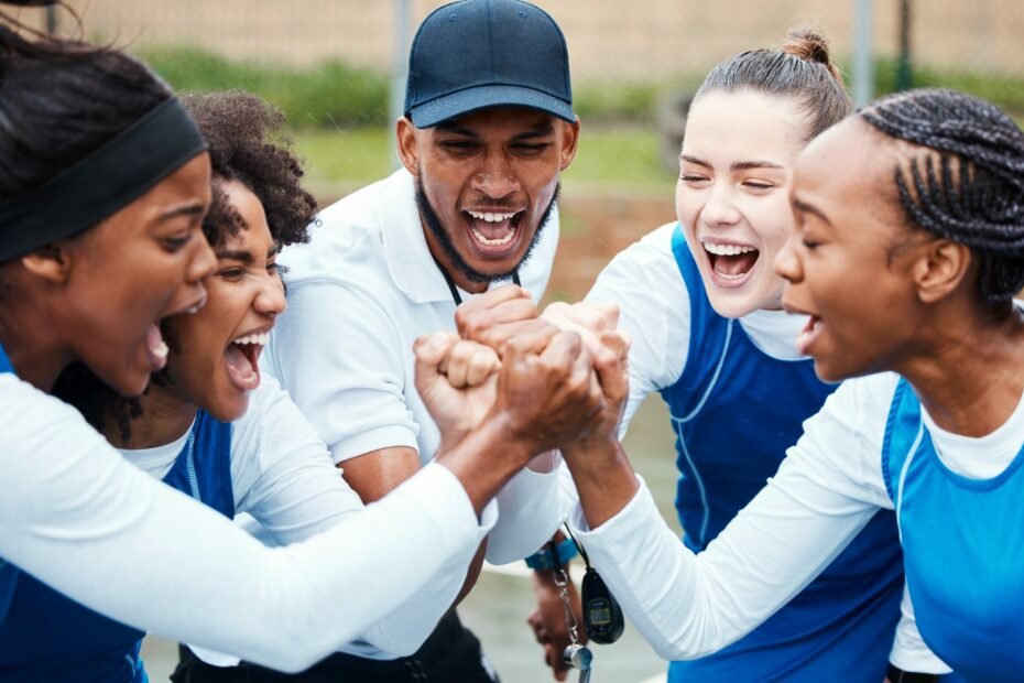 athletes joining in a circle
